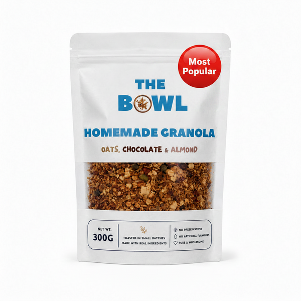 Package of 'The Bowl' Homemade Granola with visible ingredients on a white background. Healthy Granola in Pakistan
